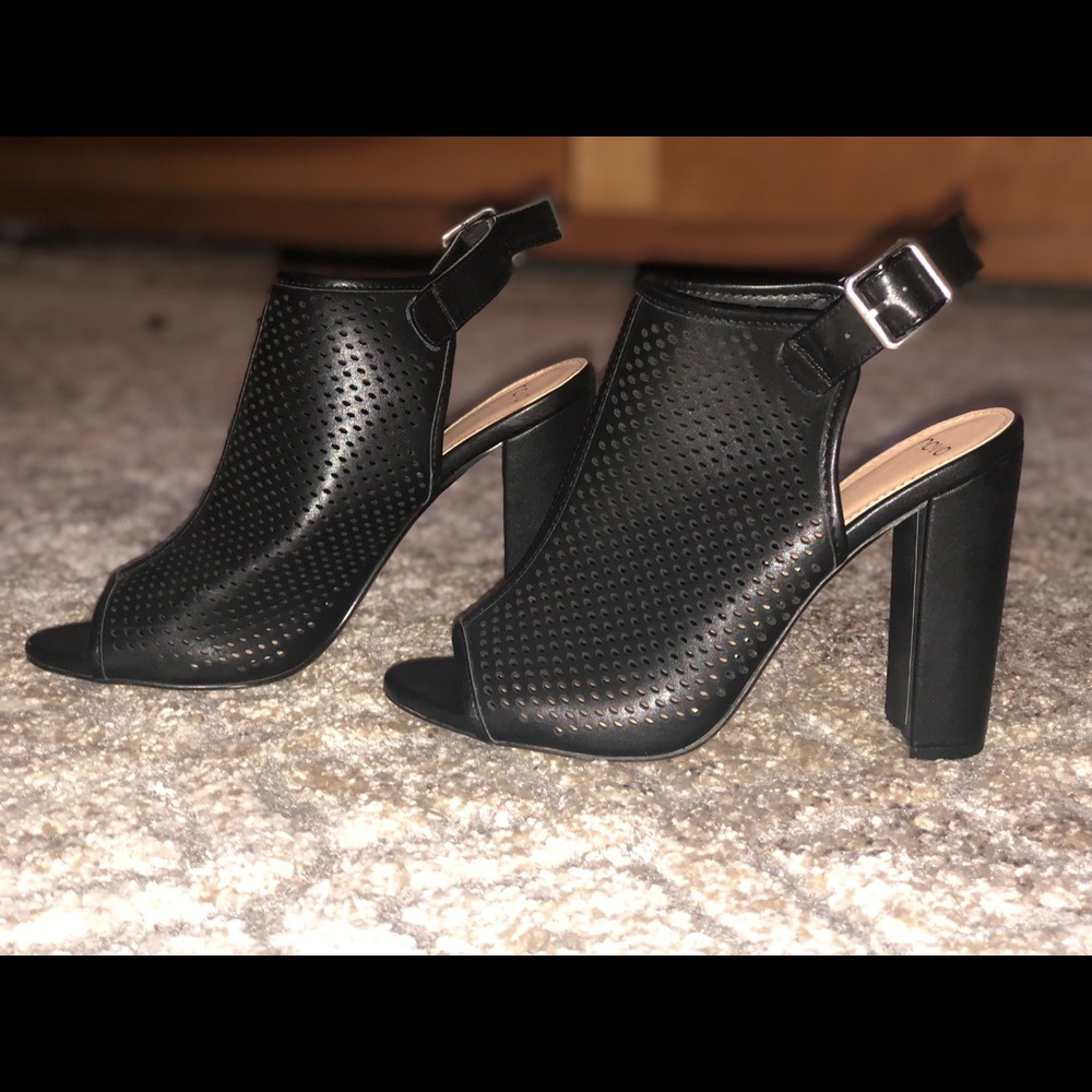 4.5 inch opened back/ toed heels,with buckled back